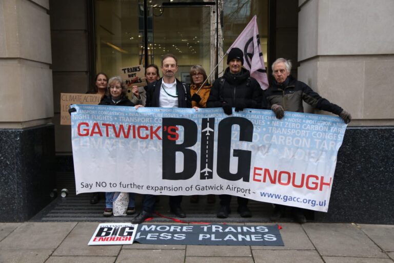 Protesters holding banner