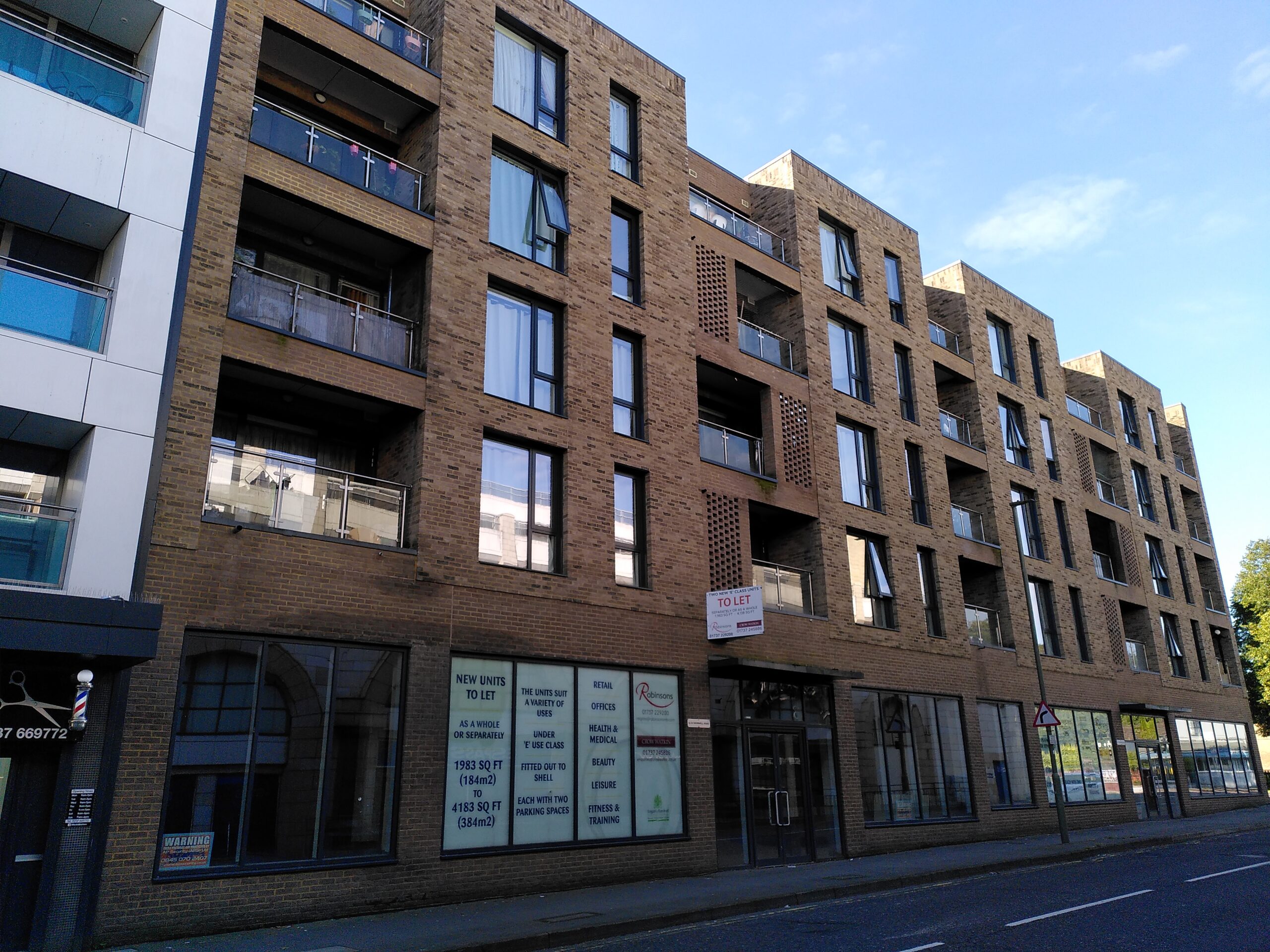 Row of shops underneath flats